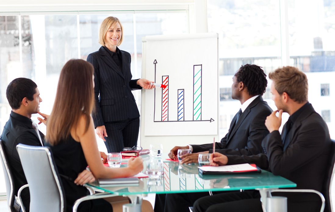 Businesswoman reporting to sales in a seminar